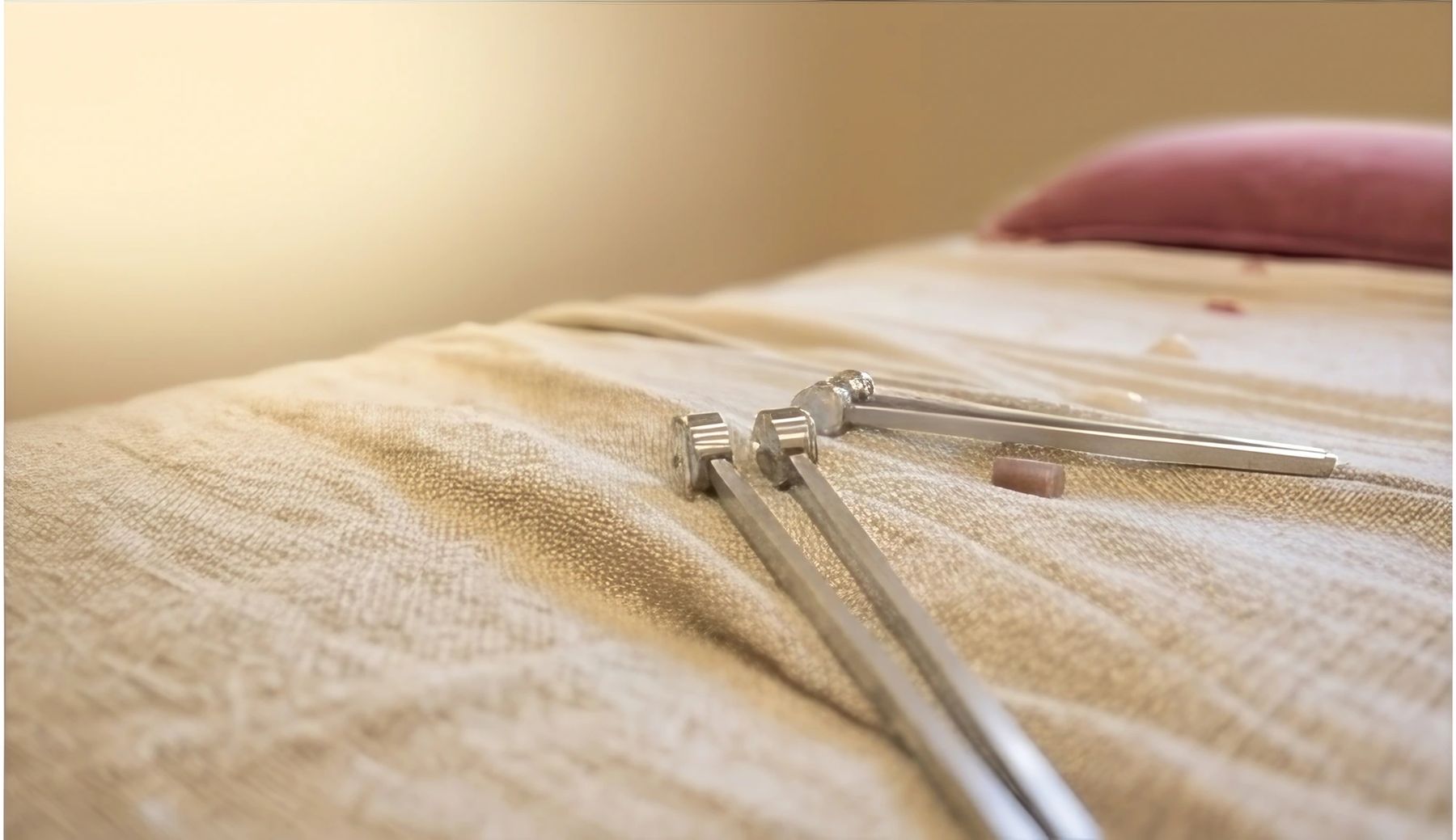 Tuning forks resting on soft linen at Terra Lume.